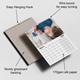 A 2026 wall calendar lies open to March, featuring a photo of a mother lying next to her baby. The image includes labelled annotations highlighting product features: an easy hanging hook, wire binding for smooth page turning, sturdy greyboard backing for durability, and 170gsm silk paper for a premium feel. The layout is clean and professional, ideal for promotional or product listing use.