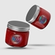 Two glass jars filled with red jam or sauce, sealed with silver screw-top lids. Each jar features a square transparent label with a holographic foil print reading Your Logo. The jars are positioned dynamically against a light grey background.