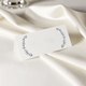 wedding place card in elegant design printed on folded white cardstock ready for you to write your names. Set on a softly draped ivory tablecloth, creating a sophisticated and timeless look.