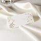 wedding place card in elegant design printed on folded white cardstock ready for you to write your names. Set on a softly draped ivory tablecloth, creating a sophisticated and timeless look.