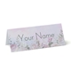 Personalised wedding place card with your name in elegant design on folded white cardstock. Minimalist design, set against a plain white background for a clean and sophisticated look.