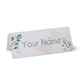 Personalised wedding place card with your name in elegant design on folded white cardstock. Minimalist design, set against a plain white background for a clean and sophisticated look.