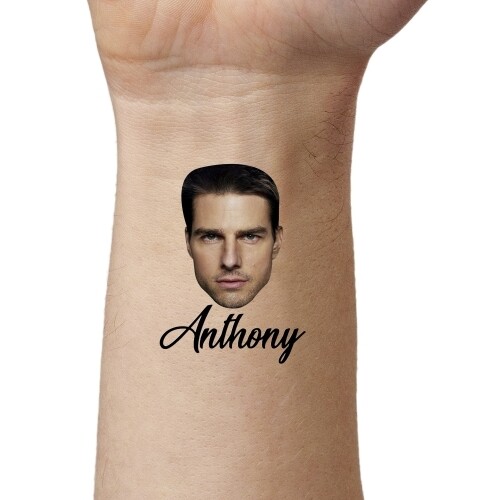 Close-up of an arm displaying a temporary tattoo featuring a man's face above the name 