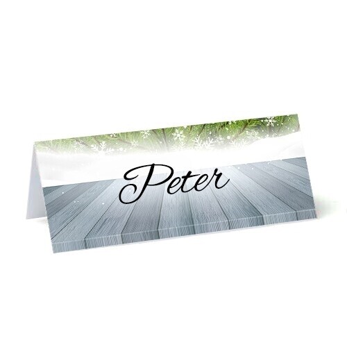 personalised place cards on 250gsm card wooden effect background with green christmas wreath and white falling snow